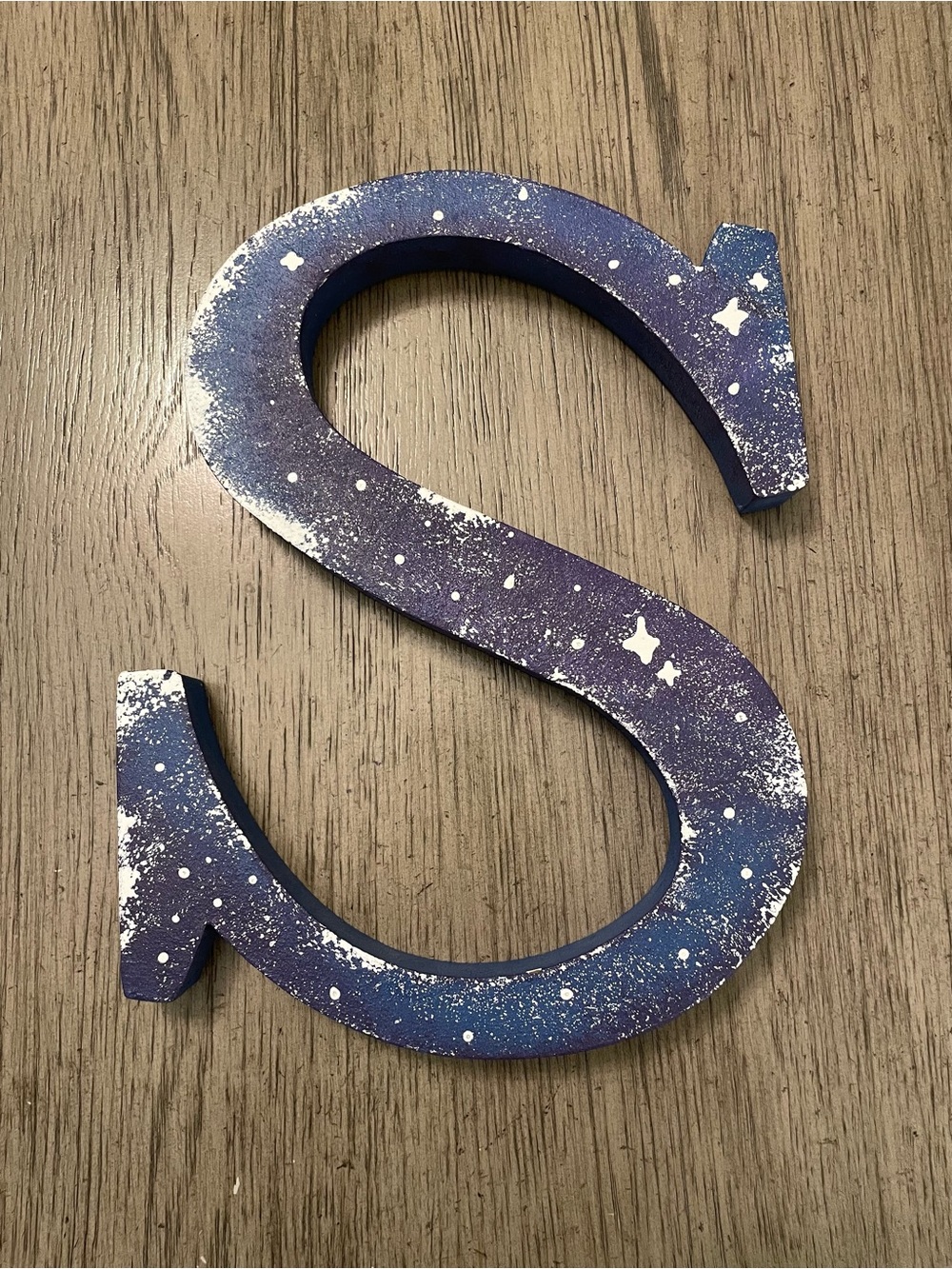 Decorative wooden “S” wall hanging. 12x9x1.